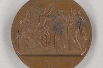 Das Bild zeigt eine Medaille aus Bronze, Rückseite